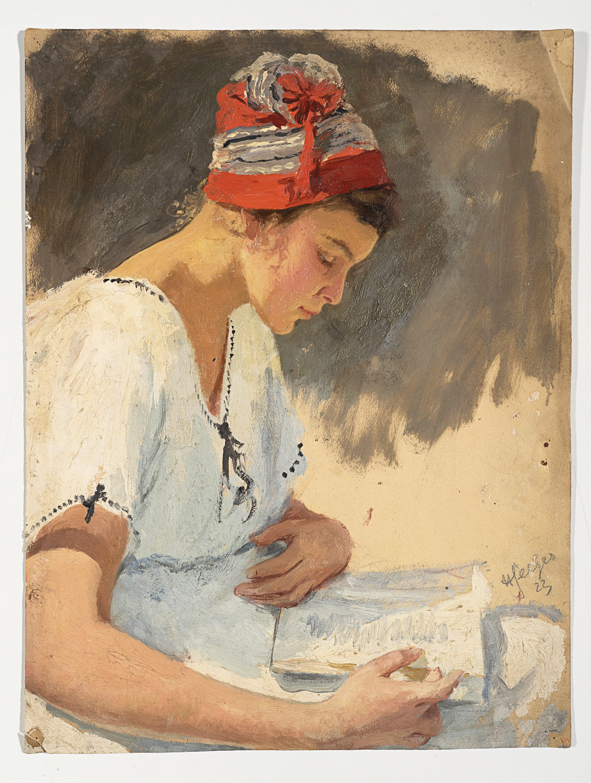 Lesende junge Frau mit Mütze