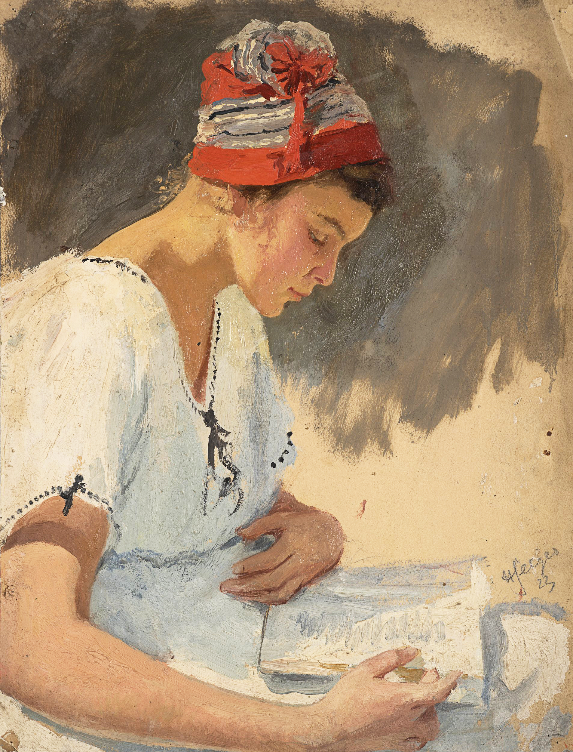 Lesende junge Frau mit Mütze