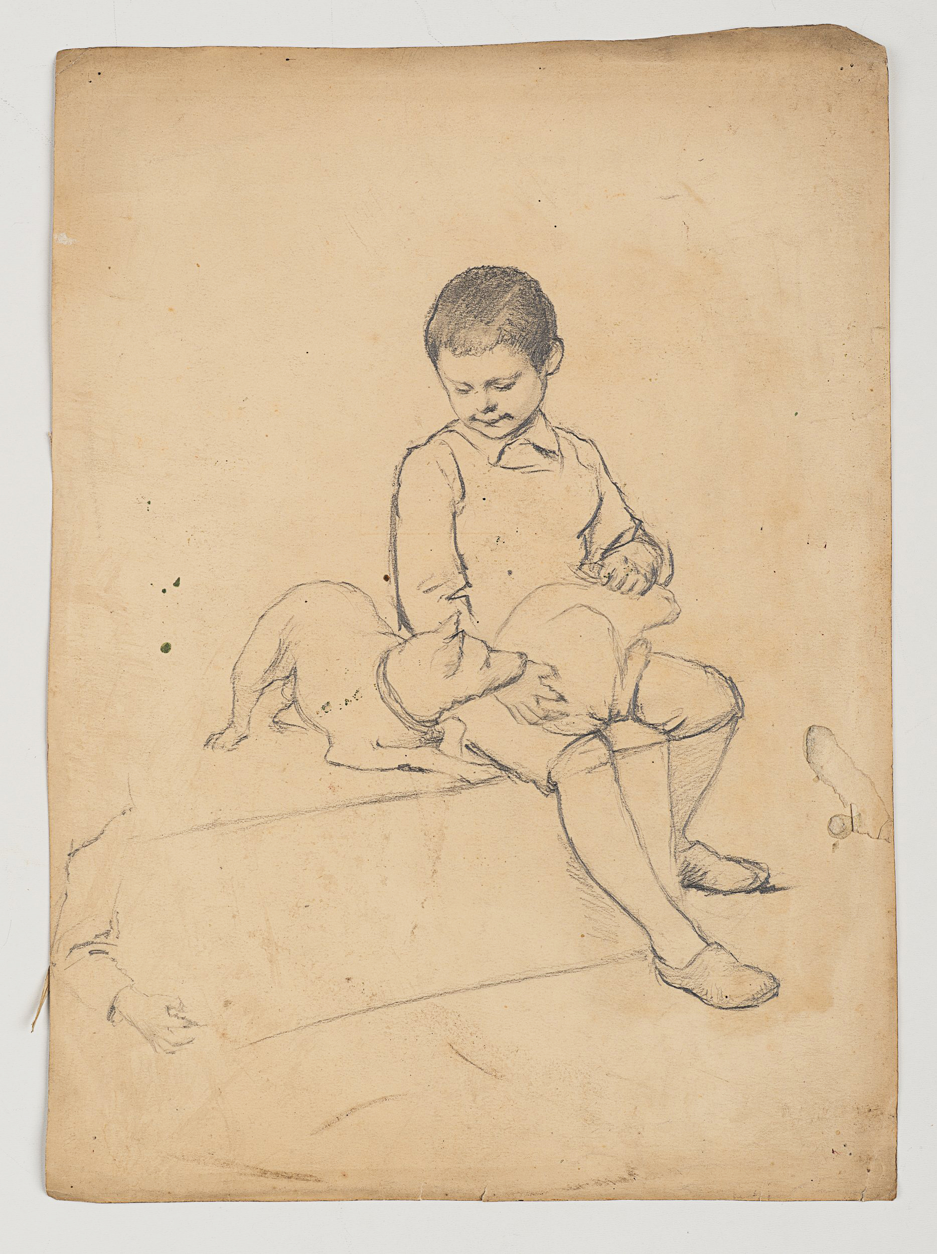 Knabe mit Hund auf dem Schoß