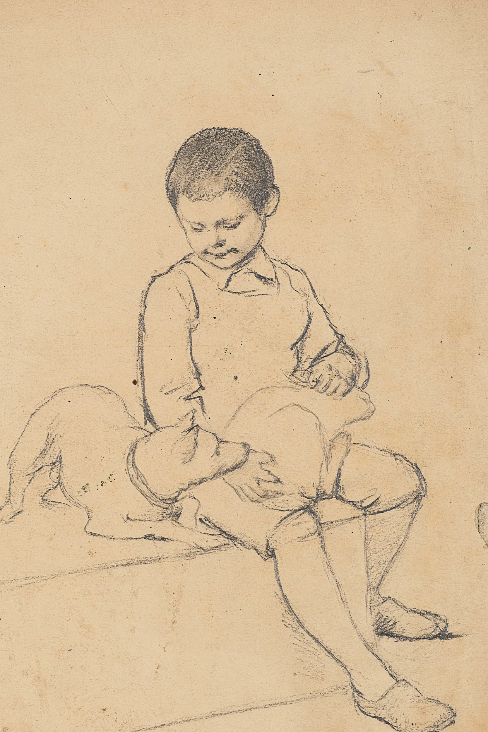 Knabe mit Hund auf dem Schoß