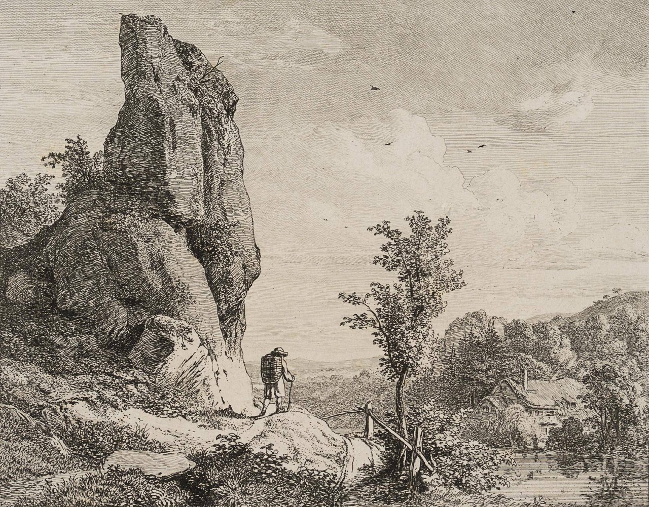 Wanderer am kegelförmigen Felsen